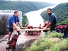 Derek Marshall & Garvin Jacobs carrying in the generator to bolt the sport route at Pompies Pillar ~1999. Photo was stolen, ie not given, but noted! Photo taken by Mei Elsen.